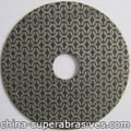 Electroplated diamond grinding pad 